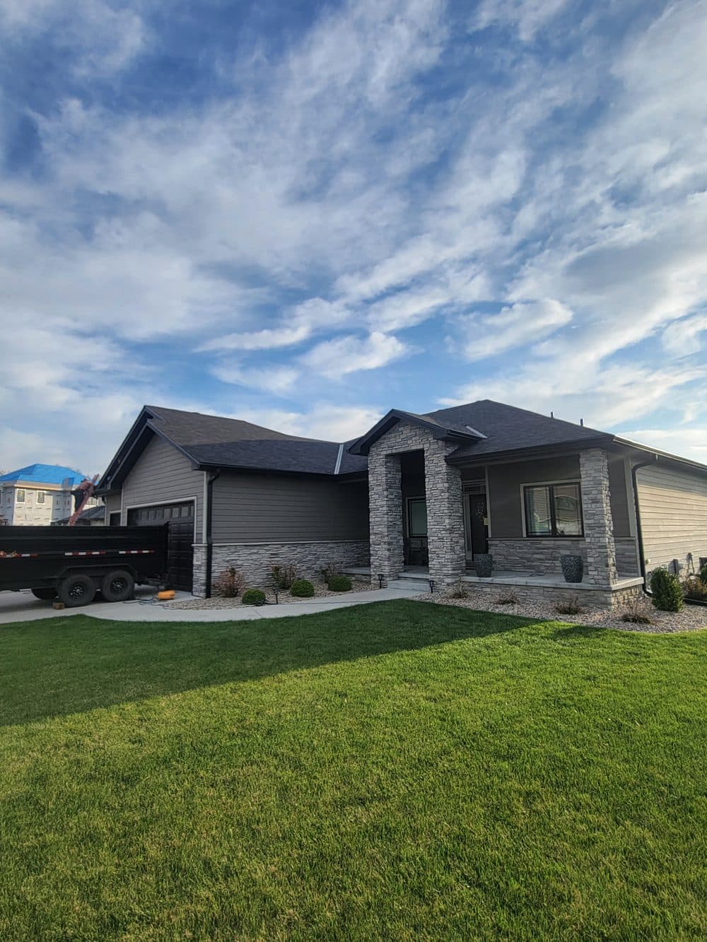 After: new dark shingle roof completed