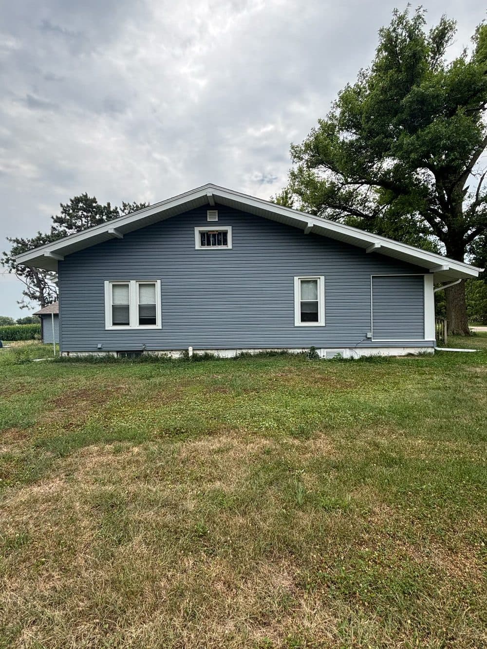 After: new blue vinyl siding