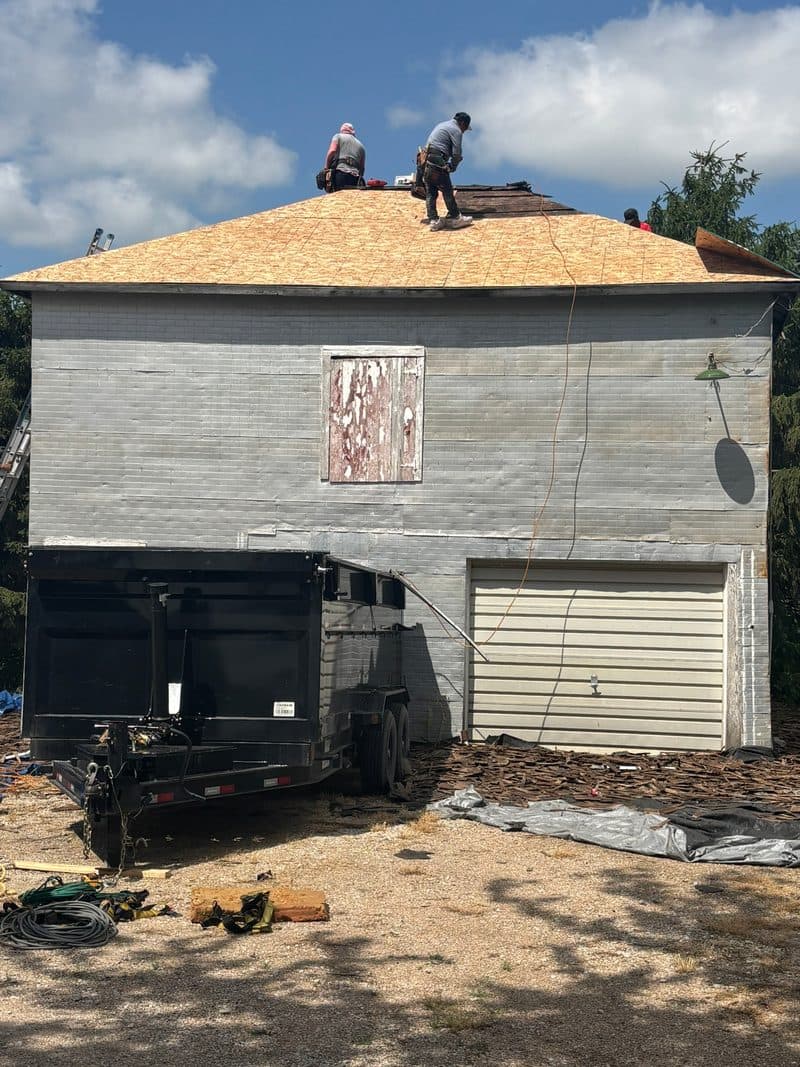 Crew tearing off an old roof, Arlington NE