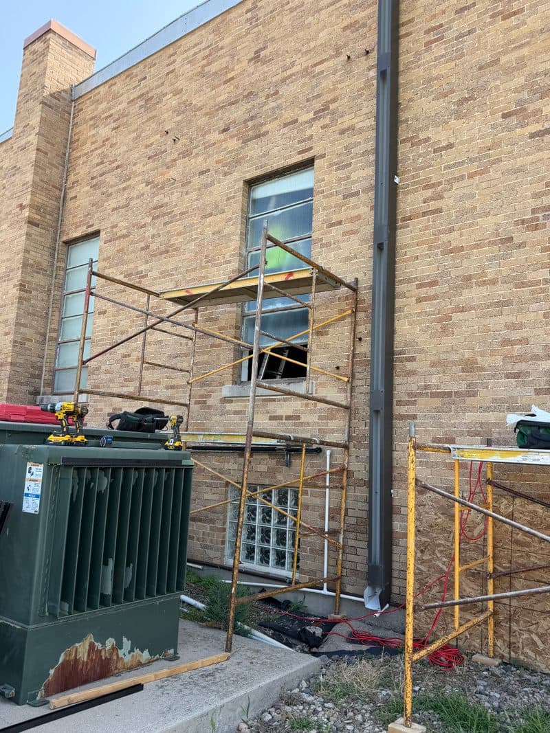 Mid-install: scaffolding set up for window work, Arlington NE