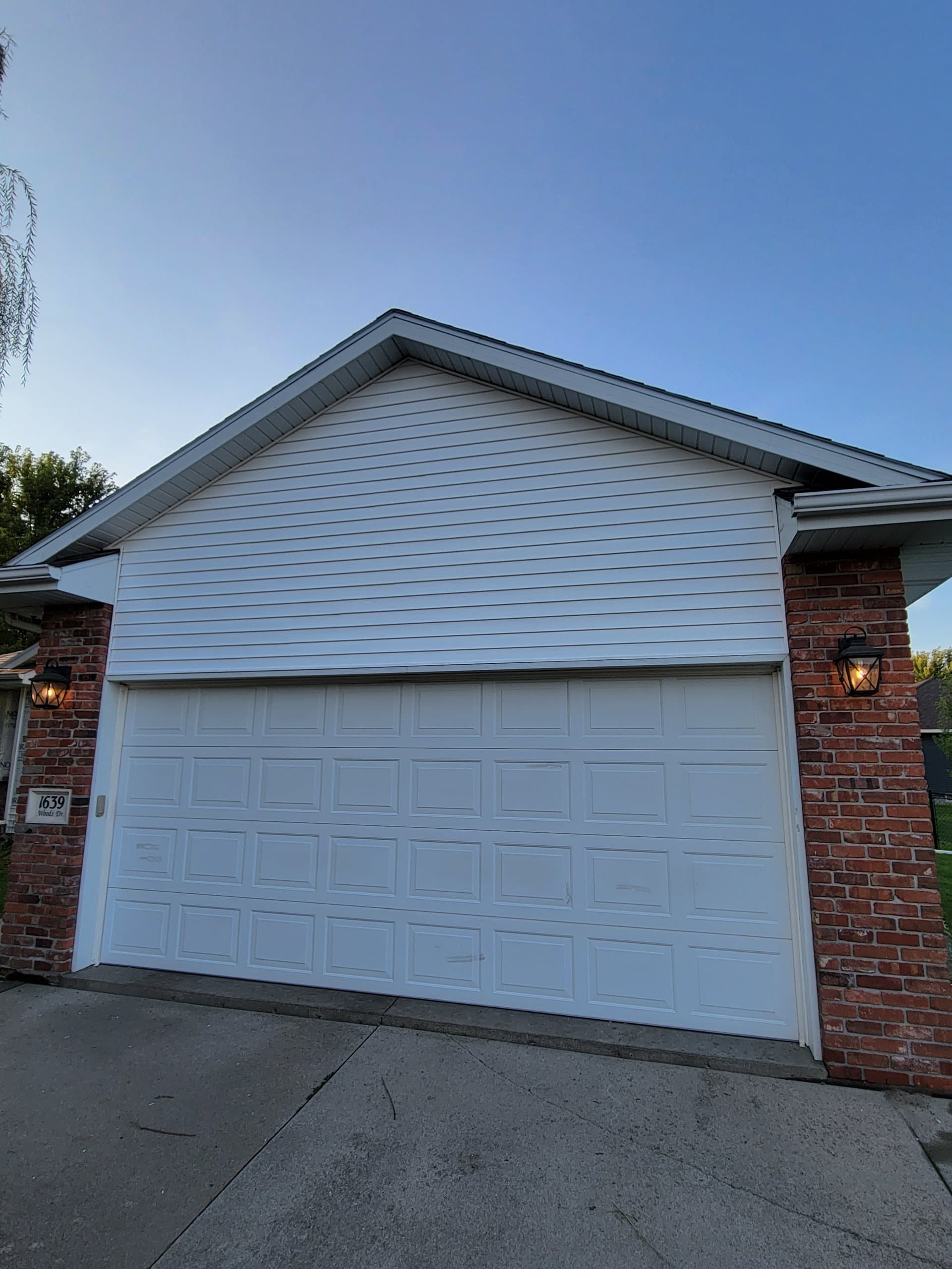 Completed vinyl siding garage install