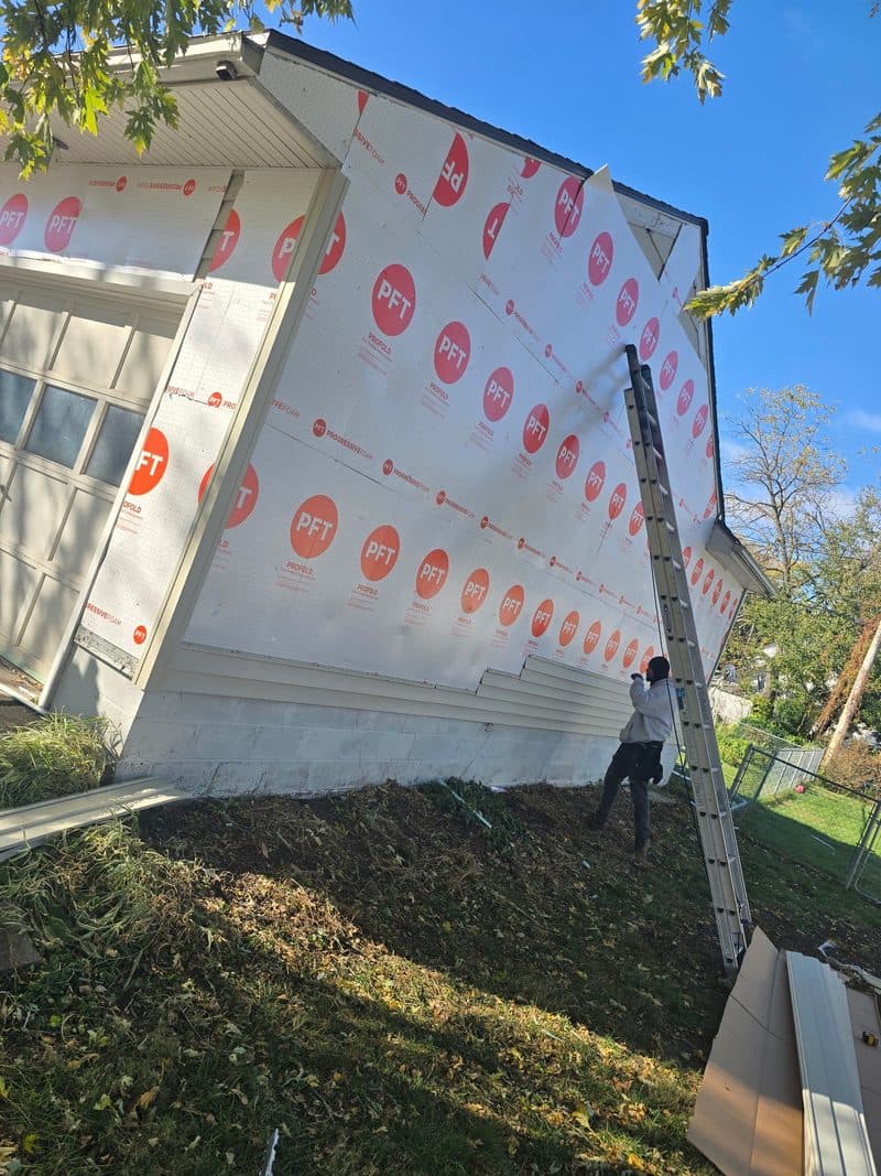 Mid-install: house wrapped with weather barrier, Fremont NE